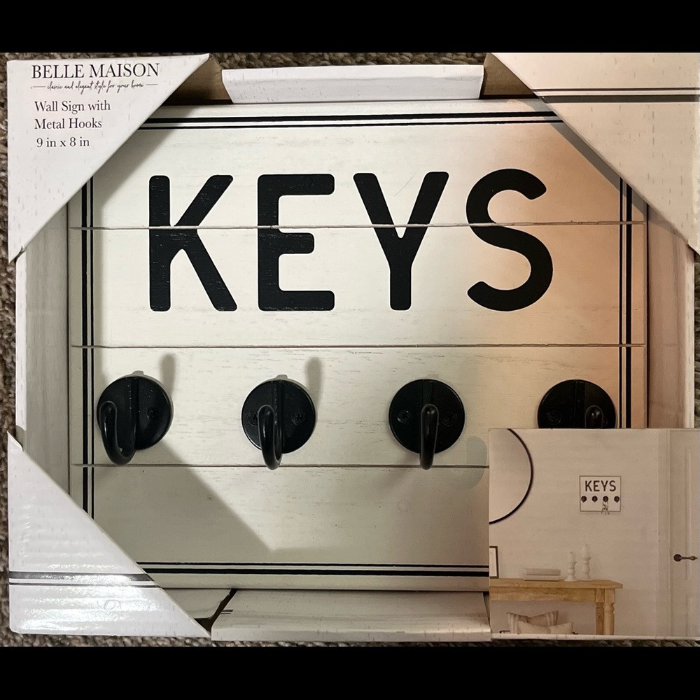 Wall sign with metal hooks